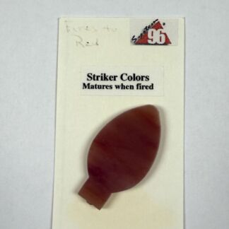 Card labeled 'Striker Colors Matures when fired' with a reddish blob sample attached, on a pale background outside the card edge.
