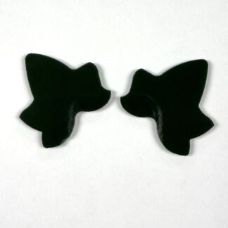 Two black starfish-shaped cutouts arranged facing each other on a white background.
