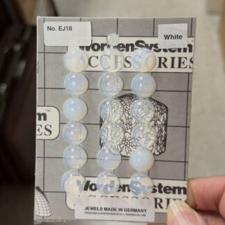 Card packaging displaying a strand of light blue marbled round beads attached to the card, labeled accessories kit.